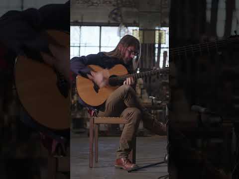 South African guitar player Guy Buttery performs in a giant warehouse