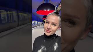 Bold Hair Transformation in a Vibrant Subway Setting