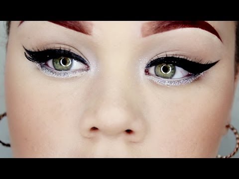 Video: Makeup untuk Tahun Baru 2014-15: mata smokey, eyeliner dan bibir di latar depan