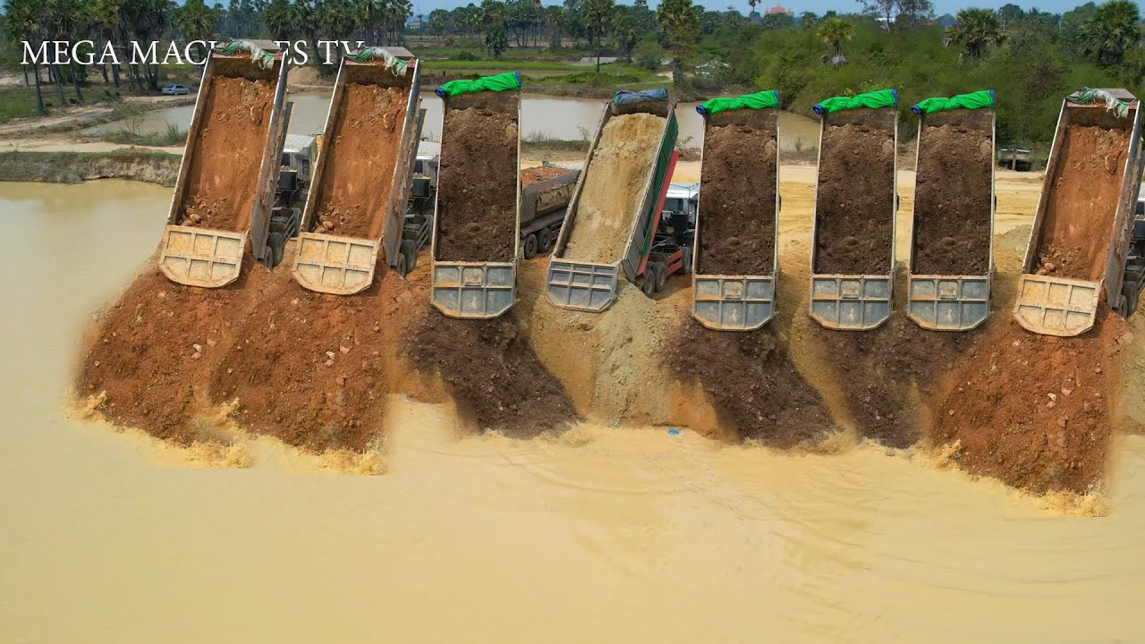 Huge Land Reclamation Process Dump Truck Unloading Operating Skills huge-land-reclamation-process-dump-truck-unloading-operating-skills