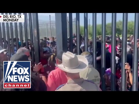 Fox News captures 'shocking' footage of migrants forcing way past border