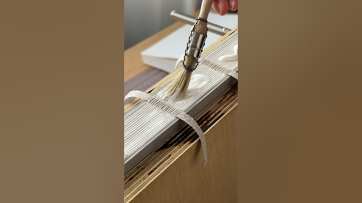 Rounded spine bookbinding process