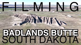 FILMING dramatic aerial views of an ancient Butte in Badlands, South Dakota