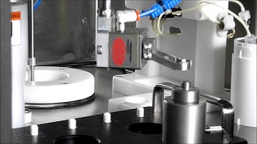 AseptiBot dispensing solution into capsules