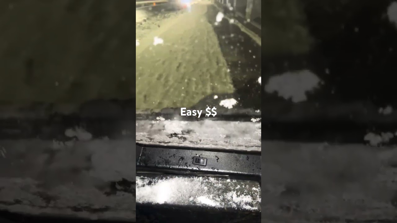 Bobcat plows sidewalks downtown Boston