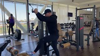 Standing neutral grip lat pull down
