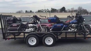 4 Electra Glides on a 16 foot trailer: srkcycles.com