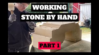 STONEMASON WORKING A FULL STONE BY HAND