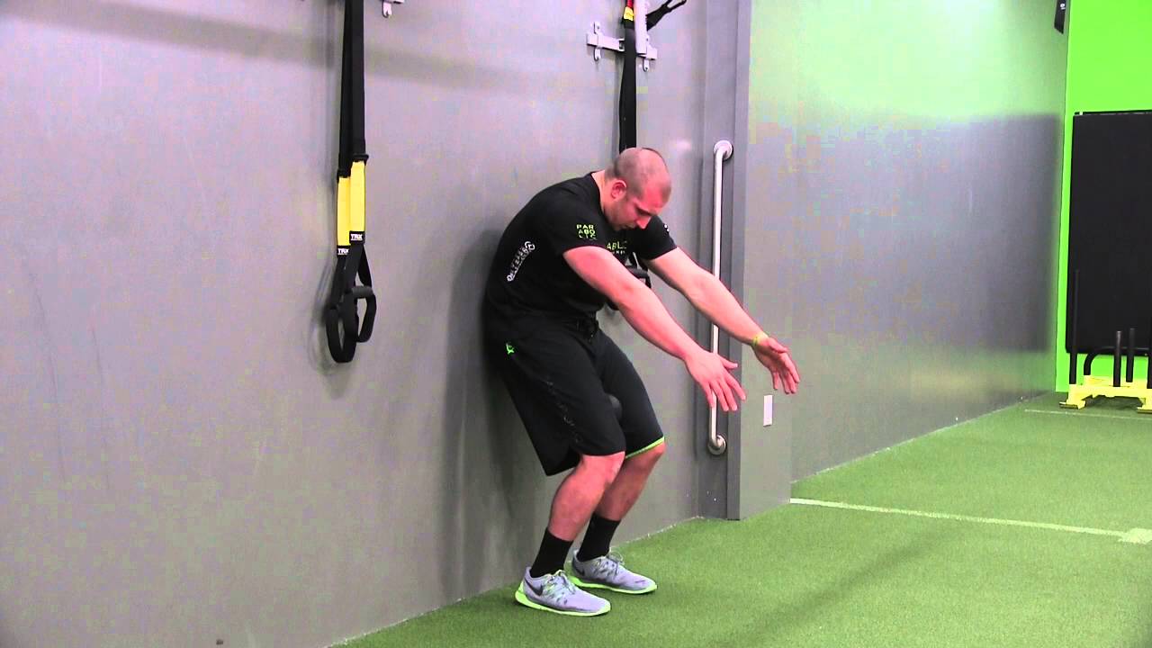 Performance Exercise Series Wall Supported Squat With Double Arm Reach