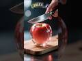 شاهد تقطيع تفاحة زجاجية بالسكين كأنها حقيقية مشهد خيالي واقعي يخدع العين 