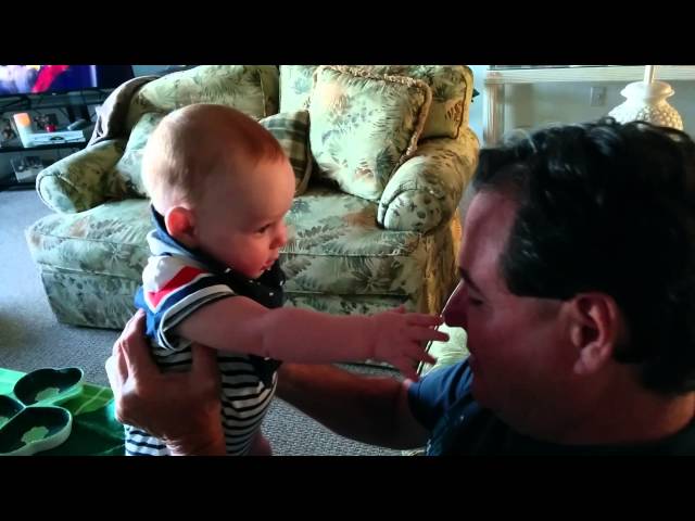 Flynn gets his fingers nibbled by Grandpa