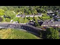 Aerial view cyclists racing on a warm summers evening