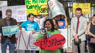 Protester outside Governor's Mansion