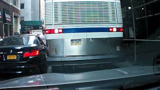 Bus slowly destroys doubleparked BMW's mirror