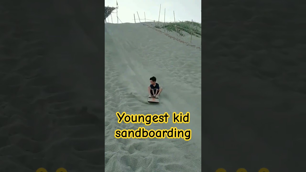 Youngest kid in sandboarding 