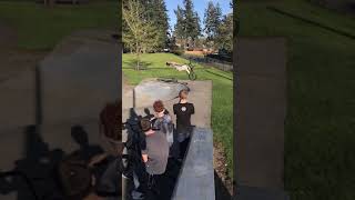 BMX rider attempts backflip from half pipe at skatepark and handlebars land on head