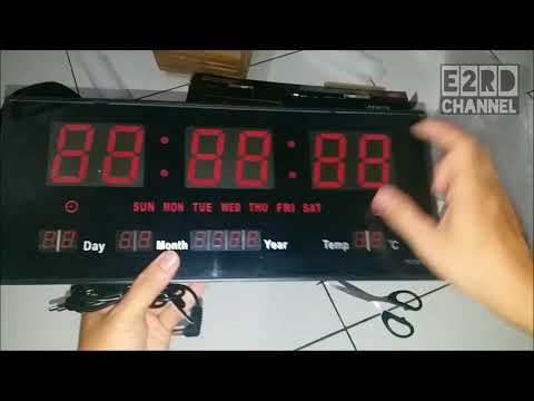 Video: Jam Dinding Elektronik: Kami Memilih Model Dengan Tampilan Digital Dan Angka Besar Di Dinding, Dengan Termometer, Bertenaga Baterai Dan Dari Listrik