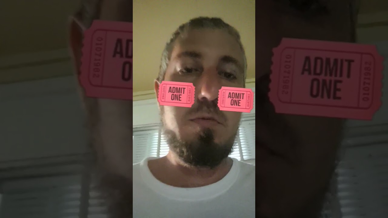 Nich with Admit One Tickets on his Face 