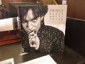 Kevin Grace visits Enoch Pratt library in Baltimore to see Steve Parke's Prince photo exhibit