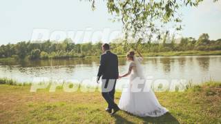 The bride and groom walk to the river bank The bride and groom walk to the river bank