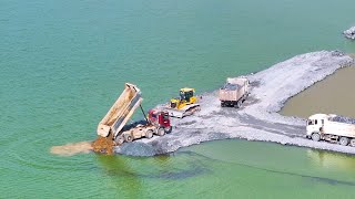 Nice Incredible Action Develop New Road on Big Lake by SHANTUI Bulldozer Pushing Rock , truck Unload