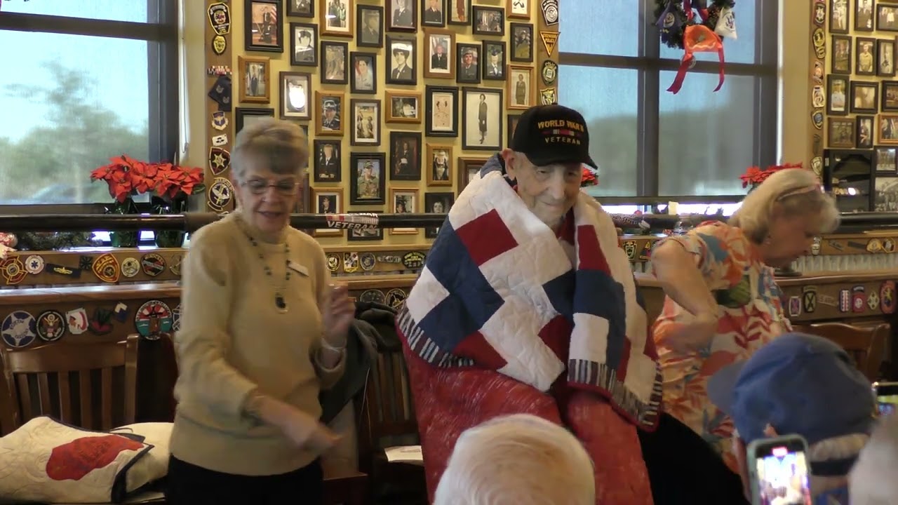 Presentation of Quilts of Valor and Ruptured Duck buttons to WWII veterans