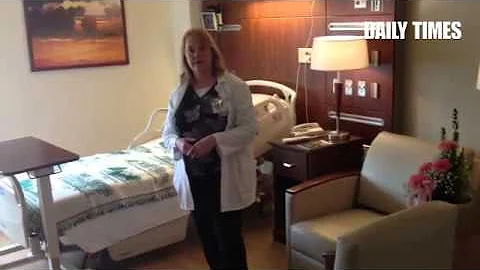Kathy Poole, nursing director, shows a new suite a...