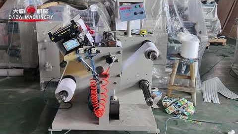 Label slitting and rewinding machine with ultrasonic web guide
