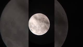 Ethereal Moonrise: Supermoon Behind the Curtain of Clouds 🌕✨