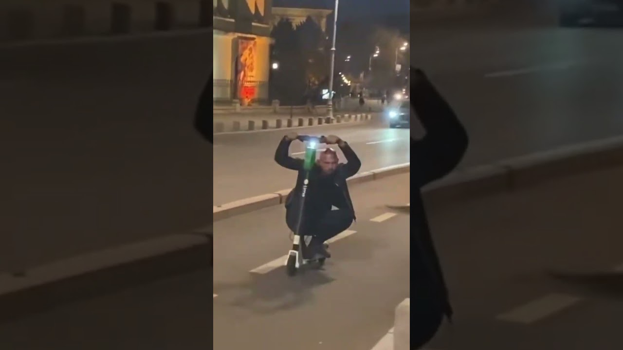Tate Showing His Moves on Electric Scooter in Paris