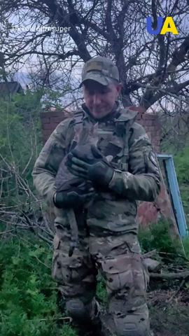 Ukrainian soldiers and their animal companions on the front line
