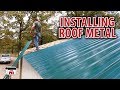 Installing roof metal on our diy shop building kits