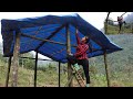 The girl finished the bamboo roof of the house wonderfully.