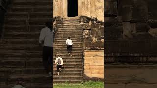 Climbing The Original Step Of Angkor Wat Temple Cambodia Cycling
