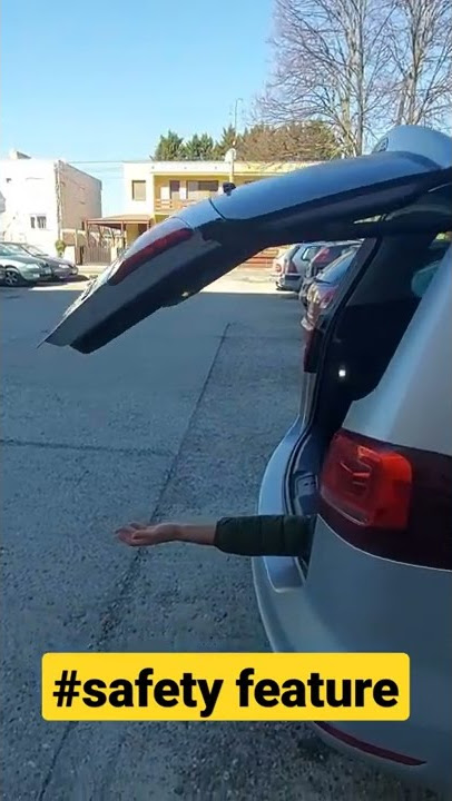 Car trunk/boot door automatic closing. Safety feature. Hand cut or not?