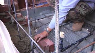 Building a Brick Chimney Demolishing an earthquake damaged brick chimney. Installing rebar for an engineered brick chimney. Laying brick on a reinforced