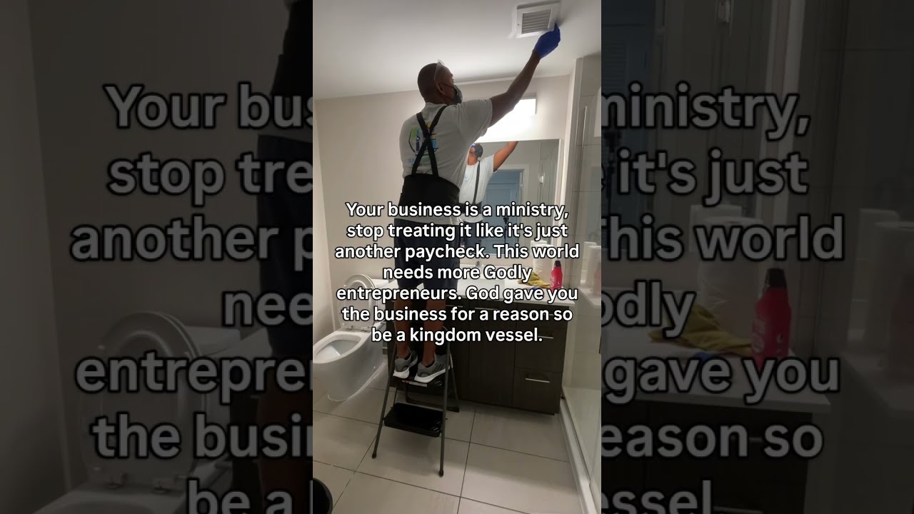 SunnySpark Cleaning team member cleaning a bathroom in Baltimore