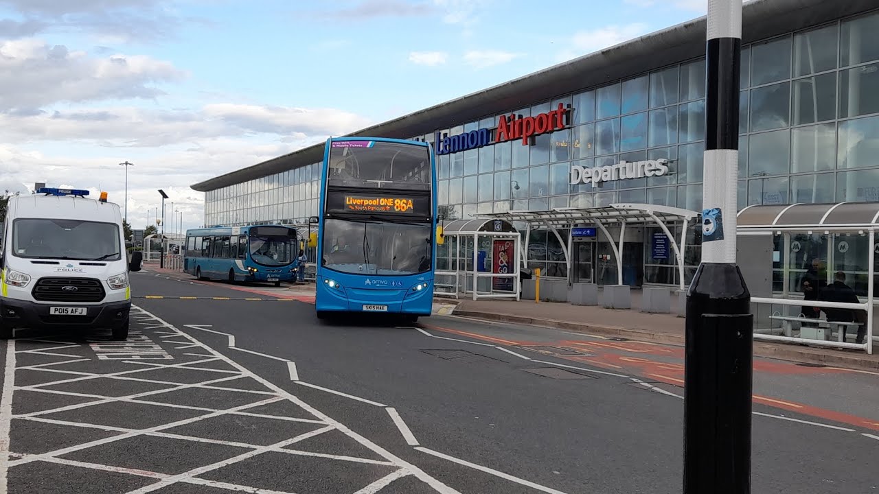 Buses at John Lennon Airport 12/7/23 (including an EasyJet and a Ryanair plane)