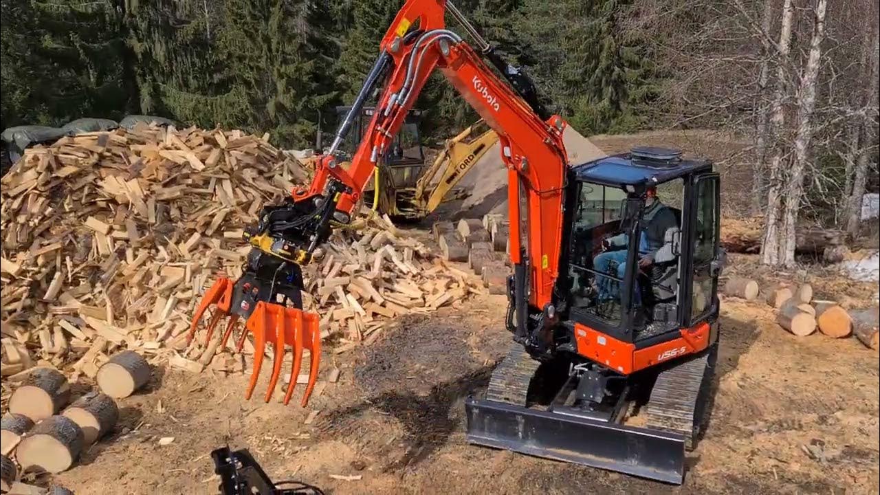 KXS88 Multipurpose grapple loading firewood to trailer. YouTube