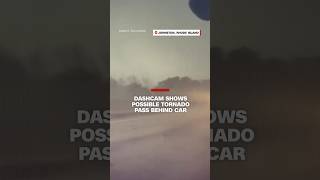 Dashcam shows possible tornado pass behind car