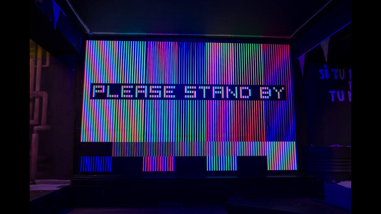 'Please Stand By' mural: a TV screen optical illusion
