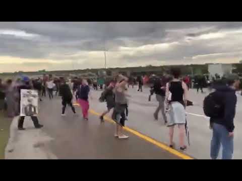 A Jeep gets shot at while driving across protesters, Aurora, Colorado.