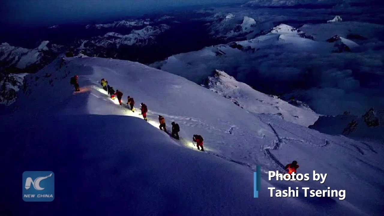 Climbers' moments with Mount Qomolangma