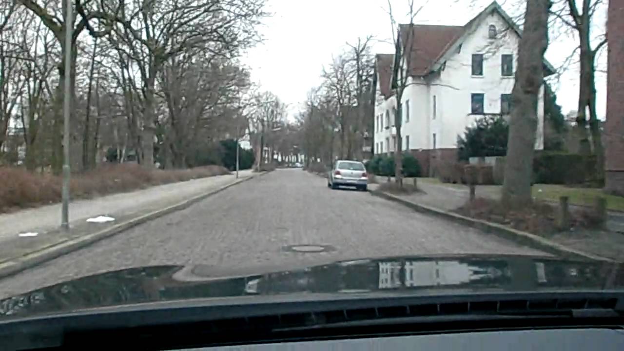 BMW 730d on cobblestone road