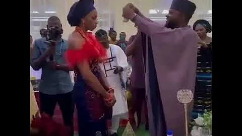 Bride refuses to smile as her husband sprays her Naira notes at their traditional wedding