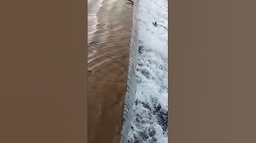 Water flowing on weir