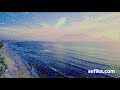 Artistic Style Transfer for a Series Of Sea Waves Kissing The Coastline Video