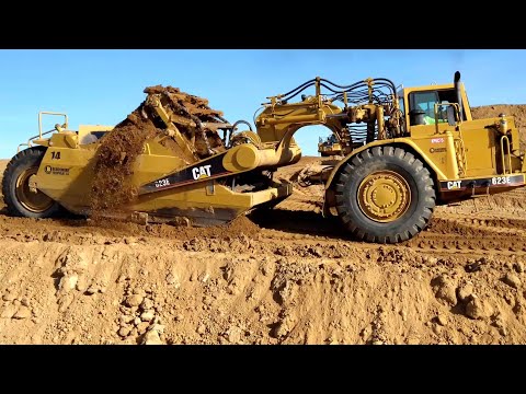 CAT 623 E and 623 K paddle scrapers in action- full loads!! - YouTube