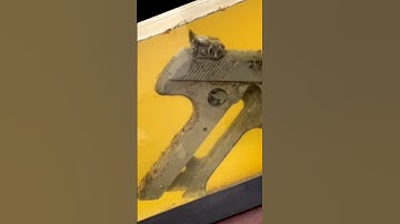 Rusty Handgun soaked in R4 Rapid Response Rust Remover for 2 hours.