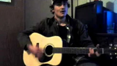 Gene Downing singing and playin guitar